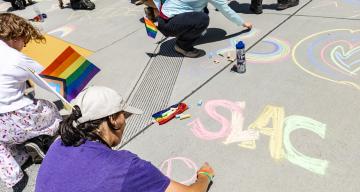SLAC staff drawing with chalk