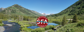 Beautiful landscape with two rivers and mountains in the background.